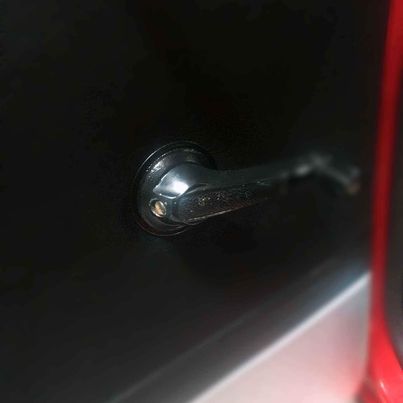 Mazda 1300 window handle surround plastic
